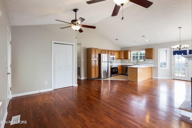 541 Pebble Creek Rd, Knoxville, TN 37918 - unfurnished living room with ceiling fan, high vaulted ceiling, a chandelier, and dark wood-style flooring