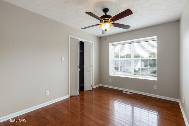 541 Pebble Creek Rd, Knoxville, TN 37918 - unfurnished bedroom featuring hardwood / wood-style flooring, a textured ceiling, a closet, and ceiling fan