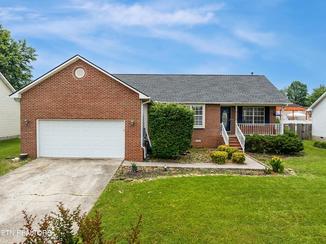 541 Pebble Creek Rd, Knoxville, TN 37918 - view of front facade with brick siding, a front lawn, covered porch, concrete driveway, and a shingled roof