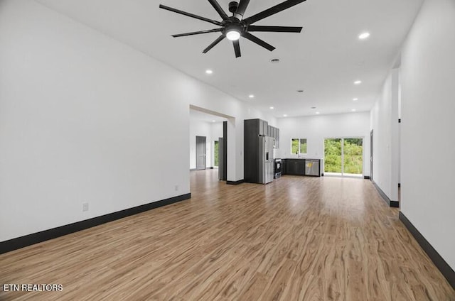 1570 W Dumplin Valley Rd, Dandridge, TN 37725 - unfurnished living room featuring light wood finished floors, ceiling fan, and recessed lighting