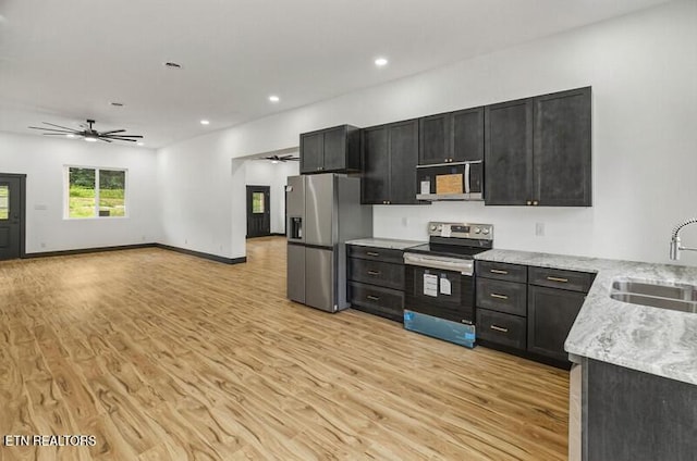 1570 W Dumplin Valley Rd, Dandridge, TN 37725 - kitchen featuring stainless steel appliances, a ceiling fan, light wood-type flooring, dark cabinets, and recessed lighting