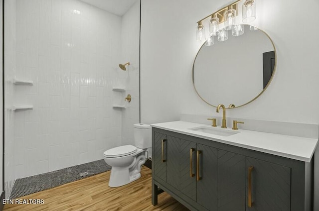 1570 W Dumplin Valley Rd, Dandridge, TN 37725 - bathroom with wood finished floors, vanity, and tiled shower