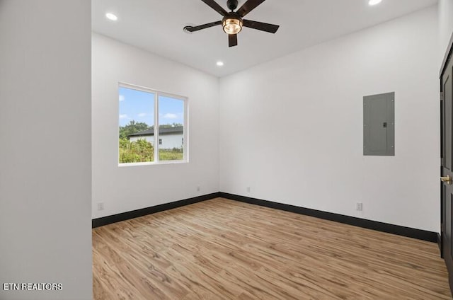 1570 W Dumplin Valley Rd, Dandridge, TN 37725 - unfurnished room featuring electric panel, ceiling fan, light wood-style floors, recessed lighting, and a water view