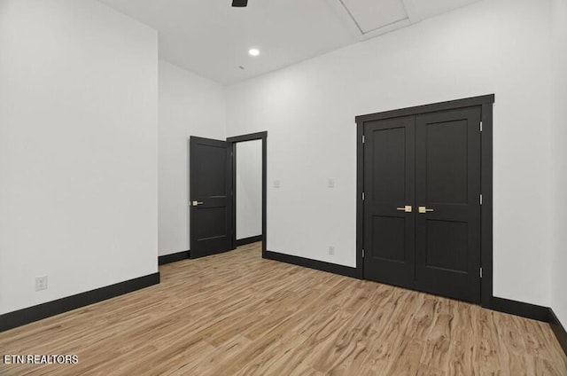 1570 W Dumplin Valley Rd, Dandridge, TN 37725 - unfurnished bedroom featuring wood finished floors and ceiling fan