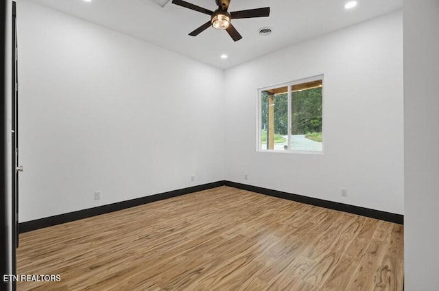 1570 W Dumplin Valley Rd, Dandridge, TN 37725 - unfurnished room featuring light wood-style floors, a ceiling fan, and recessed lighting