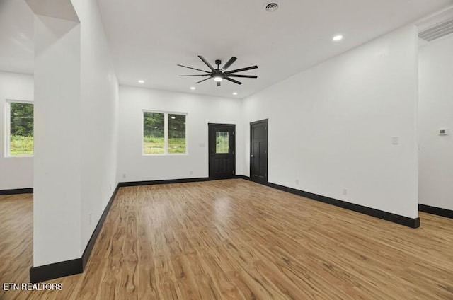 1570 W Dumplin Valley Rd, Dandridge, TN 37725 - unfurnished room featuring plenty of natural light, light wood-type flooring, a ceiling fan, and recessed lighting