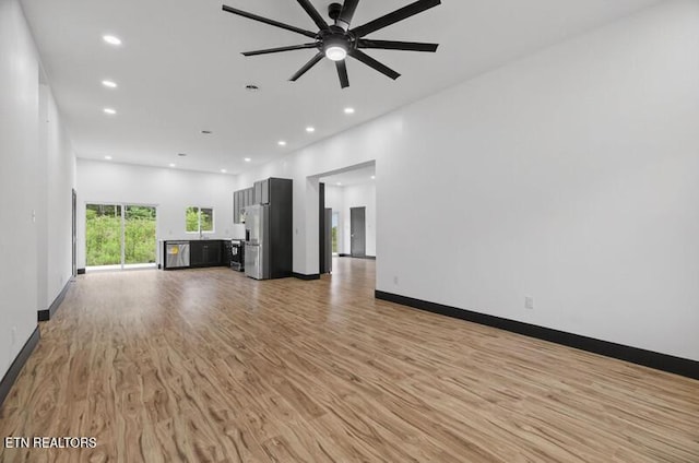 1570 W Dumplin Valley Rd, Dandridge, TN 37725 - unfurnished living room with light wood-style flooring, recessed lighting, and ceiling fan