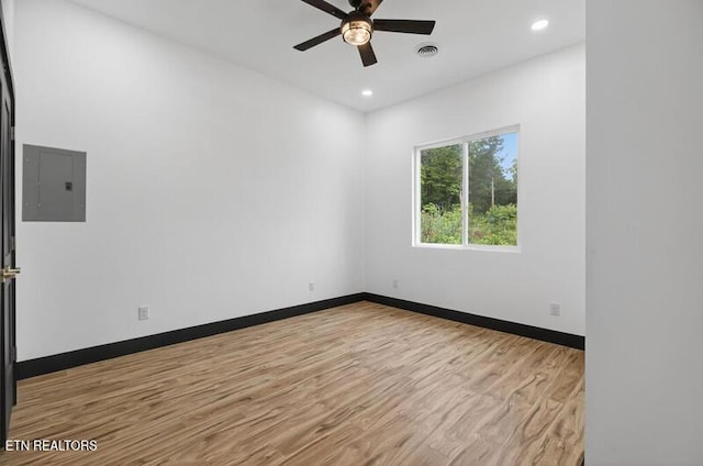 1570 W Dumplin Valley Rd, Dandridge, TN 37725 - unfurnished room with electric panel, a ceiling fan, light wood finished floors, and recessed lighting