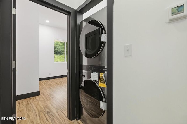 1570 W Dumplin Valley Rd, Dandridge, TN 37725 - washroom with estacked washer and dryer, light wood-type flooring, and recessed lighting