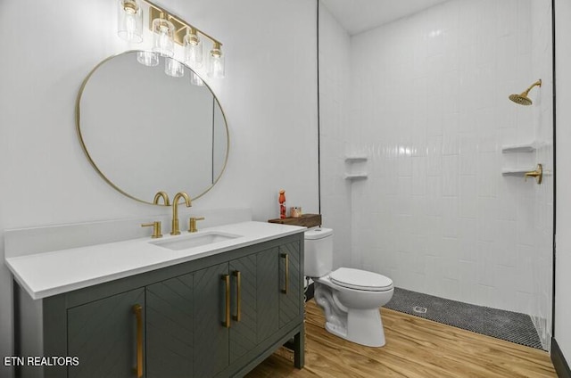 1570 W Dumplin Valley Rd, Dandridge, TN 37725 - full bath with wood finished floors, vanity, and a tile shower