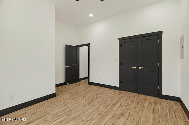 1570 W Dumplin Valley Rd, Dandridge, TN 37725 - unfurnished bedroom with light wood finished floors, electric panel, and recessed lighting
