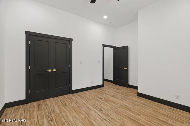 1570 W Dumplin Valley Rd, Dandridge, TN 37725 - unfurnished bedroom with light wood-style floors and ceiling fan