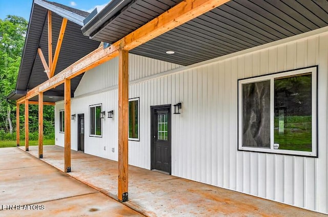 1570 W Dumplin Valley Rd, Dandridge, TN 37725 - view of exterior entry featuring a patio and board and batten siding
