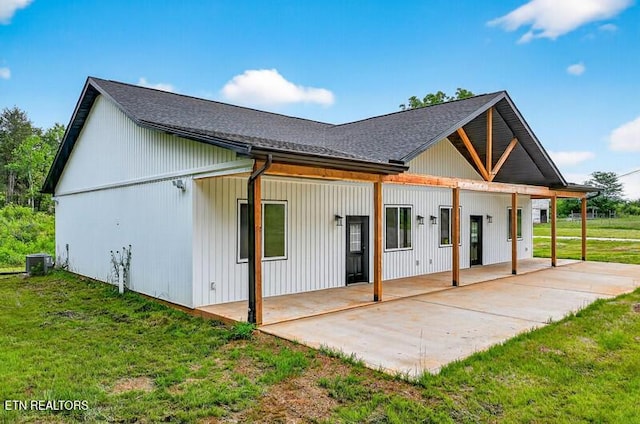 1570 W Dumplin Valley Rd, Dandridge, TN 37725 - rear view of house with a patio area, a yard, and roof with shingles