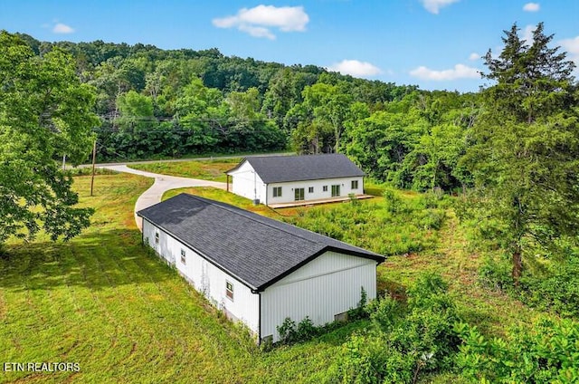 1570 W Dumplin Valley Rd, Dandridge, TN 37725 - aerial view of property and surrounding area featuring a heavily wooded area