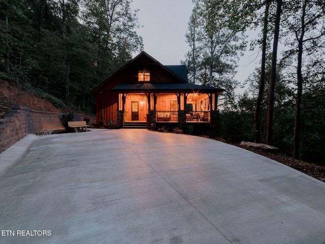 4317 Whetstone Rd, Sevierville, TN 37862 - back of property featuring covered porch and concrete driveway