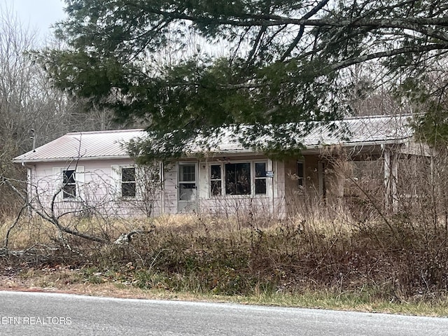 332 Ridge Rd, Lancing, TN 37770 - view of side of home featuring a metal roof