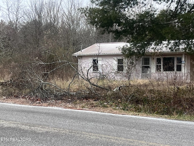 332 Ridge Rd, Lancing, TN 37770 - view of property exterior with a metal roof