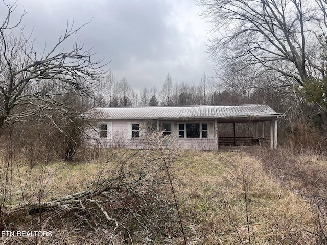 332 Ridge Rd, Lancing, TN 37770 - rear view of house with a metal roof
