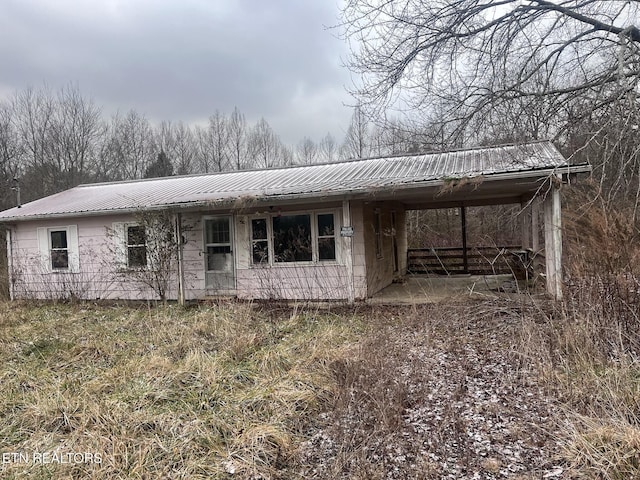 332 Ridge Rd, Lancing, TN 37770 - view of front of house with a metal roof and an attached carport