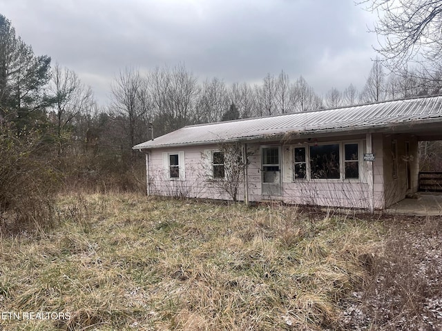 332 Ridge Rd, Lancing, TN 37770 - back of property with a metal roof