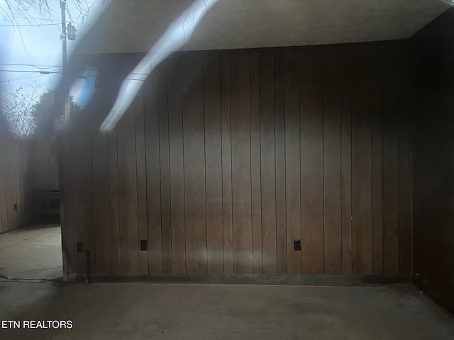 332 Ridge Rd, Lancing, TN 37770 - additional living space with concrete flooring and wooden walls