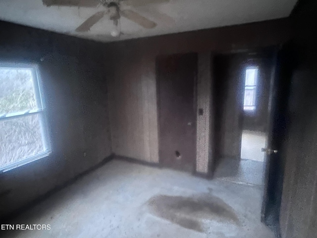 332 Ridge Rd, Lancing, TN 37770 - empty room featuring concrete floors and ceiling fan