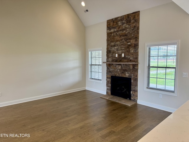 2107 Lantern Park Ln, Knoxville, TN 37932 - unfurnished living room featuring high vaulted ceiling, dark wood-style floors, and a fireplace