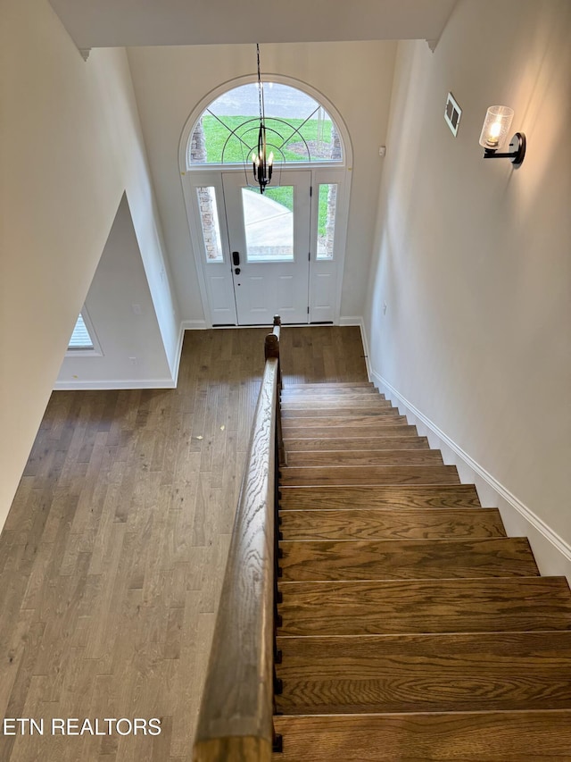 2107 Lantern Park Ln, Knoxville, TN 37932 - stairway featuring wood finished floors and a chandelier