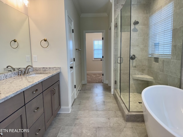 2107 Lantern Park Ln, Knoxville, TN 37932 - bathroom with vanity, a soaking tub, ornamental molding, and a shower stall
