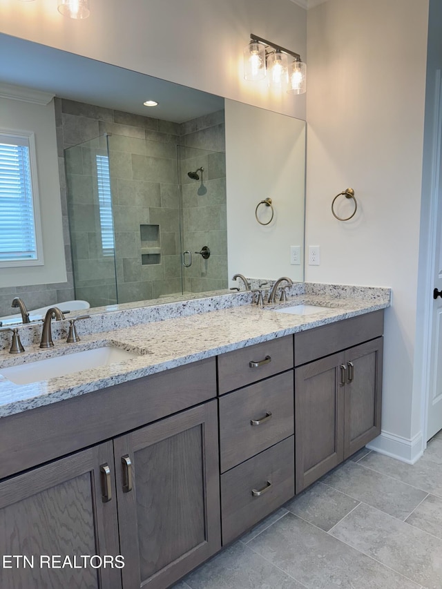 2107 Lantern Park Ln, Knoxville, TN 37932 - full bath featuring ornamental molding, double vanity, and a shower stall
