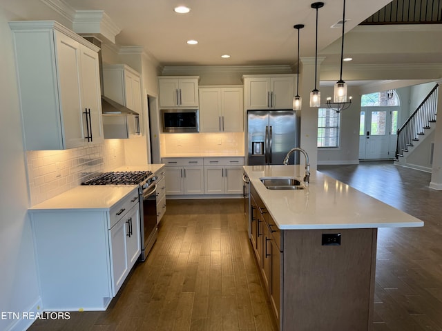 2107 Lantern Park Ln, Knoxville, TN 37932 - kitchen featuring appliances with stainless steel finishes, ornamental molding, dark wood finished floors, light countertops, and recessed lighting