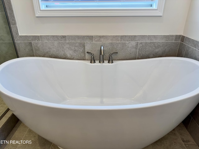 2107 Lantern Park Ln, Knoxville, TN 37932 - bathroom with a freestanding tub and healthy amount of natural light