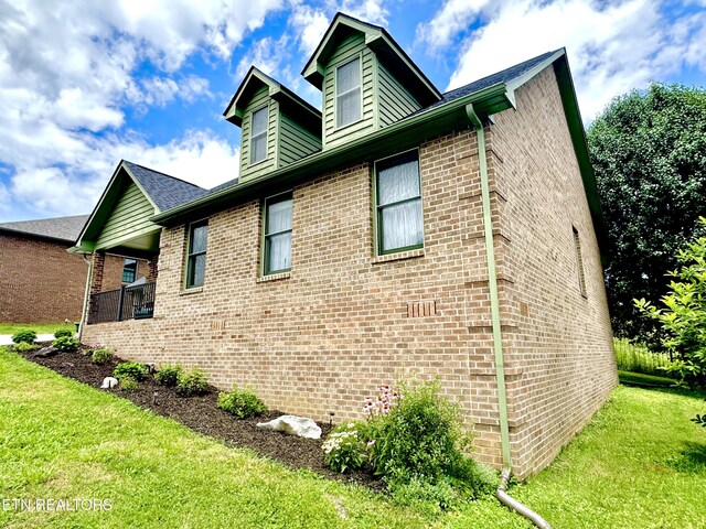 135 Whisper Creek Rd, Lafollette, TN 37766 - view of side of property featuring brick siding and a yard