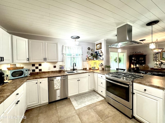 135 Whisper Creek Rd, Lafollette, TN 37766 - kitchen featuring appliances with stainless steel finishes, island range hood, dark countertops, and white cabinets