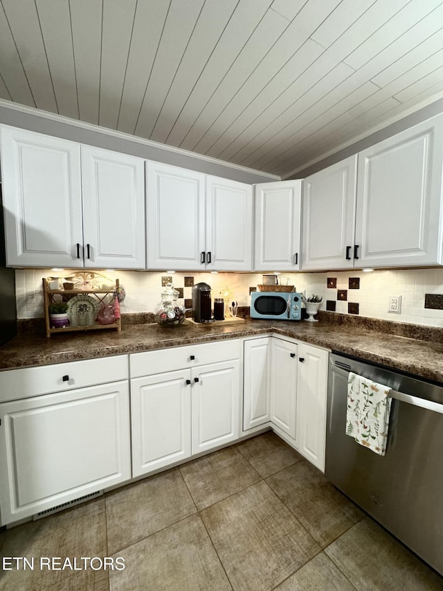 135 Whisper Creek Rd, Lafollette, TN 37766 - kitchen featuring stainless steel appliances, dark countertops, white cabinets, and wood ceiling