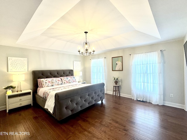 135 Whisper Creek Rd, Lafollette, TN 37766 - bedroom with a raised ceiling, a chandelier, and dark wood-style flooring