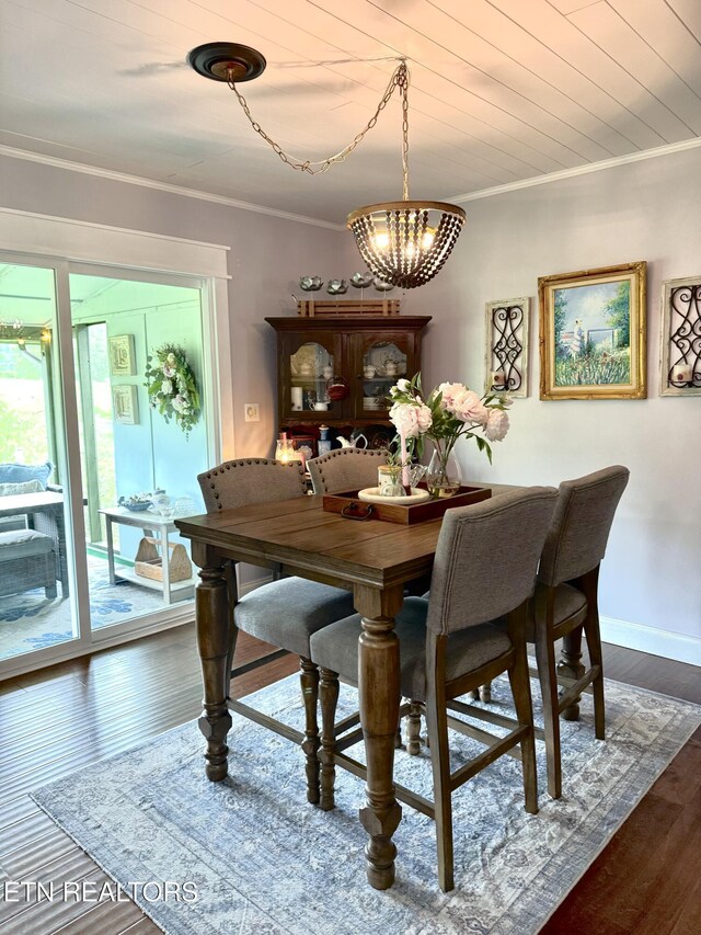 135 Whisper Creek Rd, Lafollette, TN 37766 - dining space with a chandelier, ornamental molding, and dark wood-style flooring