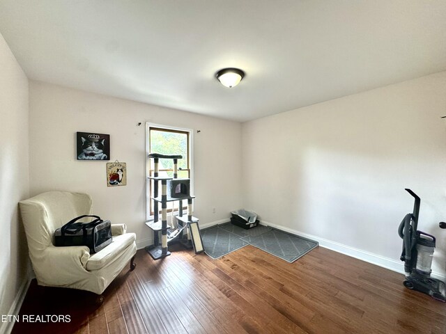 135 Whisper Creek Rd, Lafollette, TN 37766 - workout area featuring dark wood-type flooring and baseboards