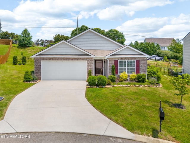 1426 Mesquite Dr, Sevierville, TN 37876 - view of front facade with a garage, concrete driveway, and brick siding