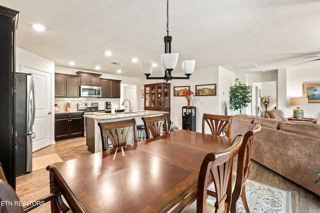 1426 Mesquite Dr, Sevierville, TN 37876 - dining space featuring a ceiling fan, light wood finished floors, and recessed lighting