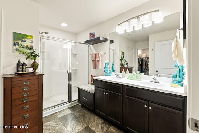 1426 Mesquite Dr, Sevierville, TN 37876 - full bathroom with double vanity, a shower stall, and stone finish floors