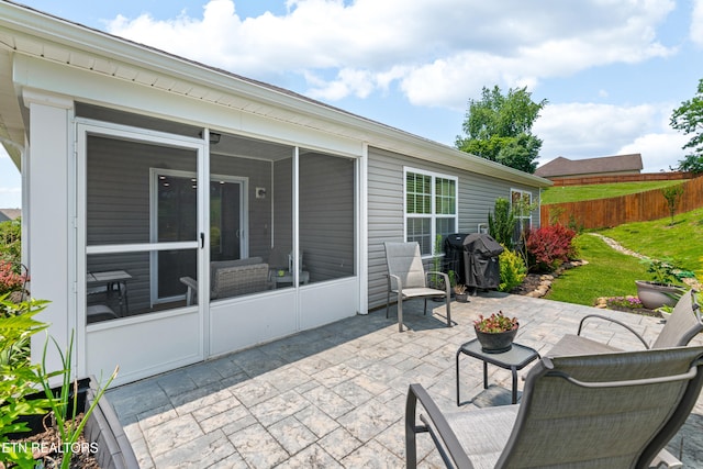 1426 Mesquite Dr, Sevierville, TN 37876 - view of patio with grilling area and a sunroom