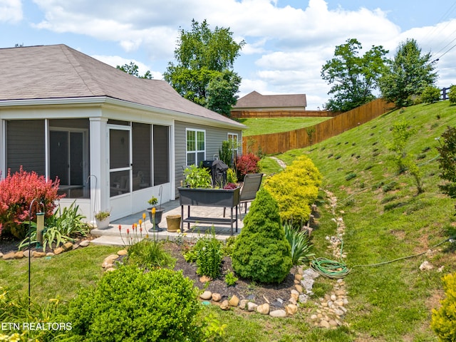 1426 Mesquite Dr, Sevierville, TN 37876 - view of yard featuring a sunroom and a patio area