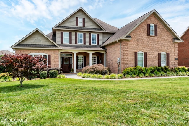 510 Argyle Way, Maryville, TN 37801 - view of front of home with a shingled roof, brick siding, a front yard, and a porch