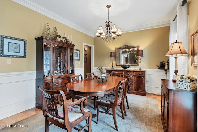510 Argyle Way, Maryville, TN 37801 - dining space with a chandelier, light wood-style floors, crown molding, and a wainscoted wall