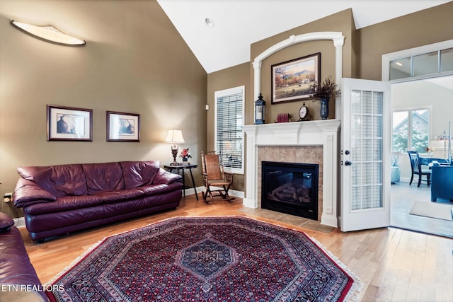 510 Argyle Way, Maryville, TN 37801 - living room featuring wood finished floors, a tile fireplace, and high vaulted ceiling