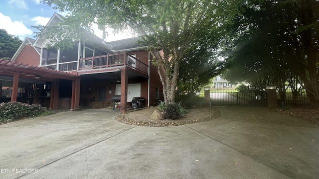 1843 River Vista Cir, Sevierville, TN 37876 - view of side of property featuring concrete driveway, a garage, a carport, and a pergola