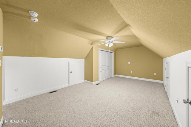 171 Wrenwood Way, Greenback, TN 37742 - additional living space featuring a textured ceiling, vaulted ceiling, light carpet, and ceiling fan