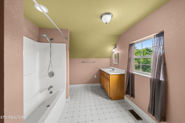 171 Wrenwood Way, Greenback, TN 37742 - bathroom featuring vanity, shower / tub combination, lofted ceiling, and tile patterned floors